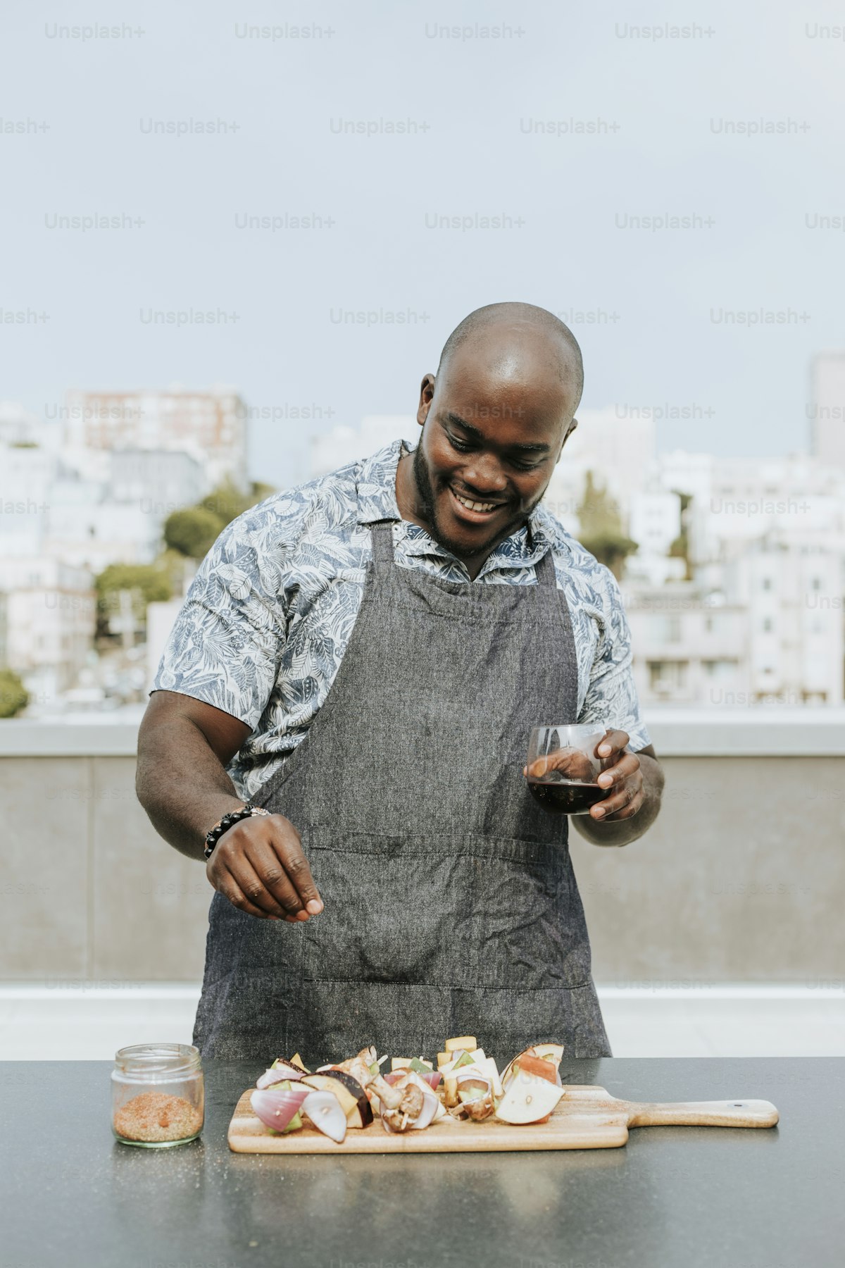 Black chef in apron cooking